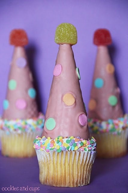 Close-up of three party hat cupcakes