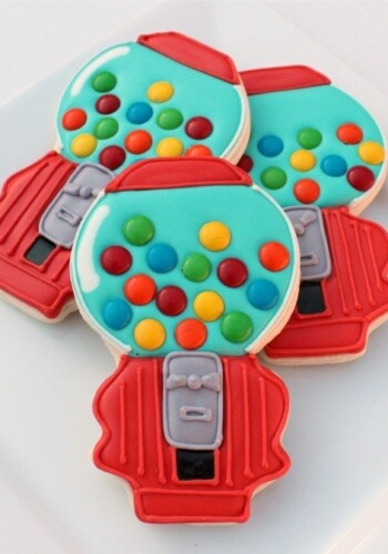 Overhead view of three gumball machine decorated cookies.