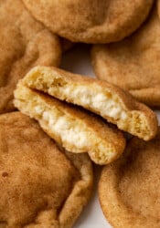 A cream cheese stuffed snickerdoodle split in half.