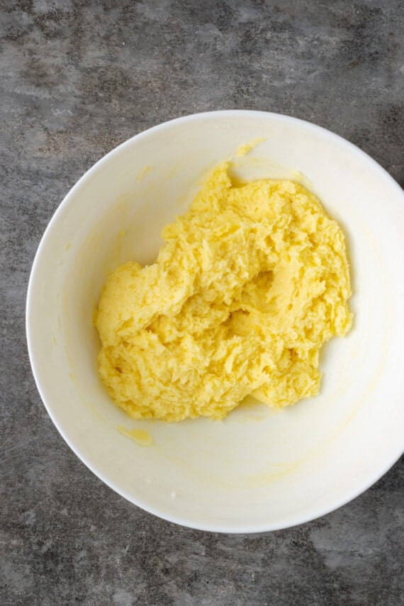 Blended eggs, butter, and sugar in a mixing bowl.