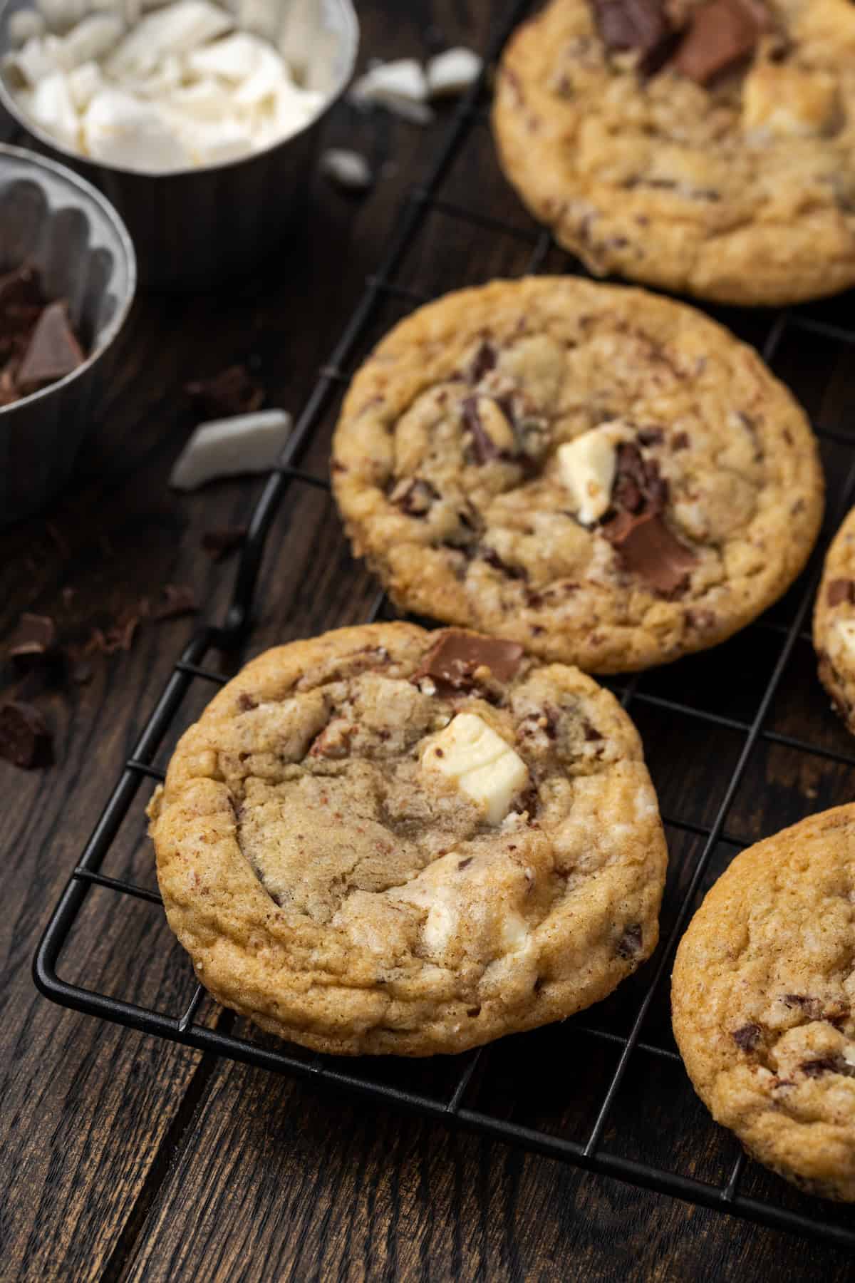 Close up of rows of triple chocolate cookies on a wire rack.