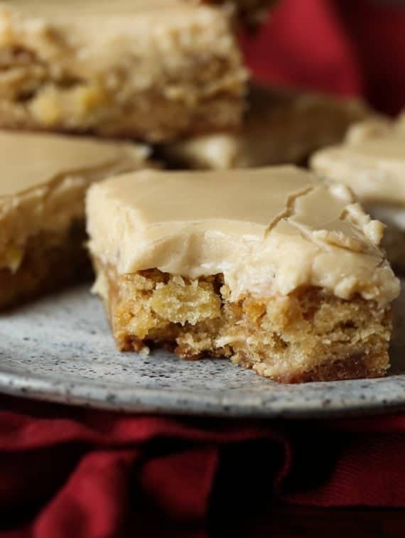 Apple Toffee Blondies are buttery blondies with tart apple pieces and sweet toffee bits! It's topped with a brown sugar frosting!