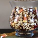 Side view of Candy Corn Bugle Snack Mix in a glass dish