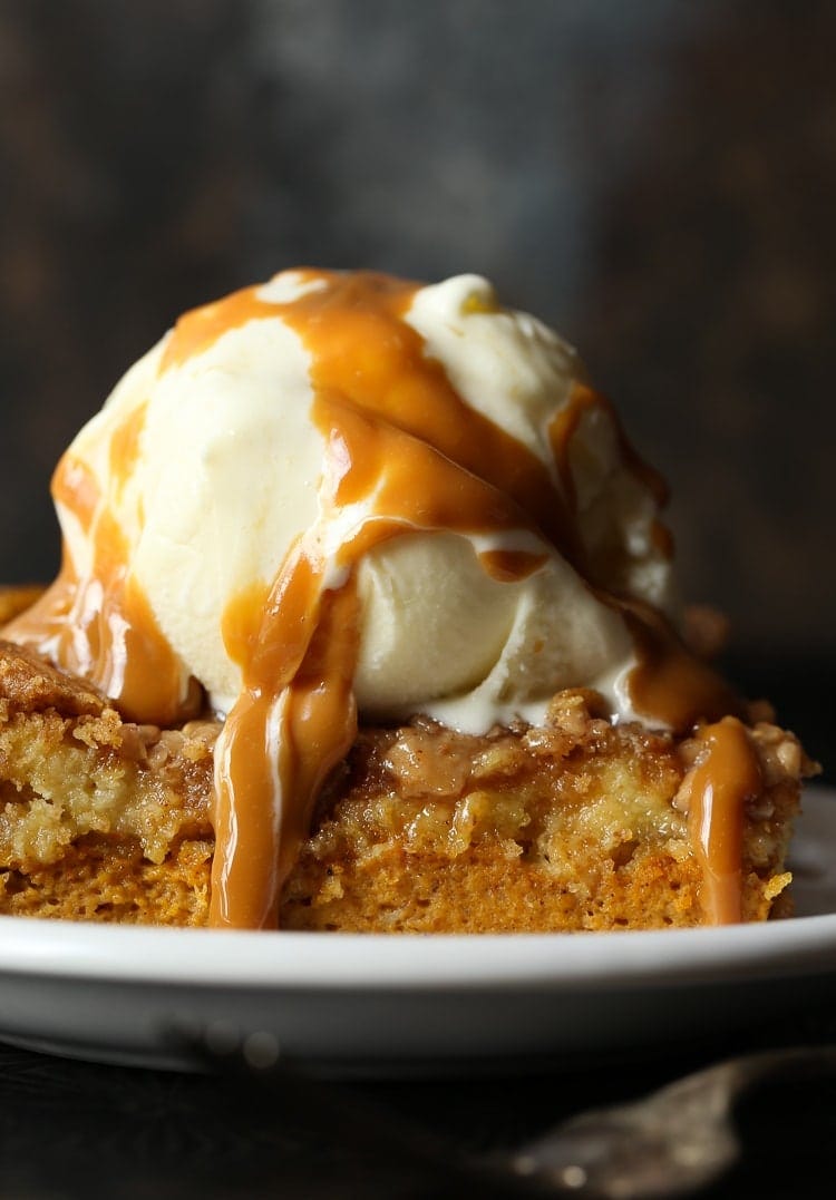 Pumpkin dump cake image with ice cream and caramel sauce