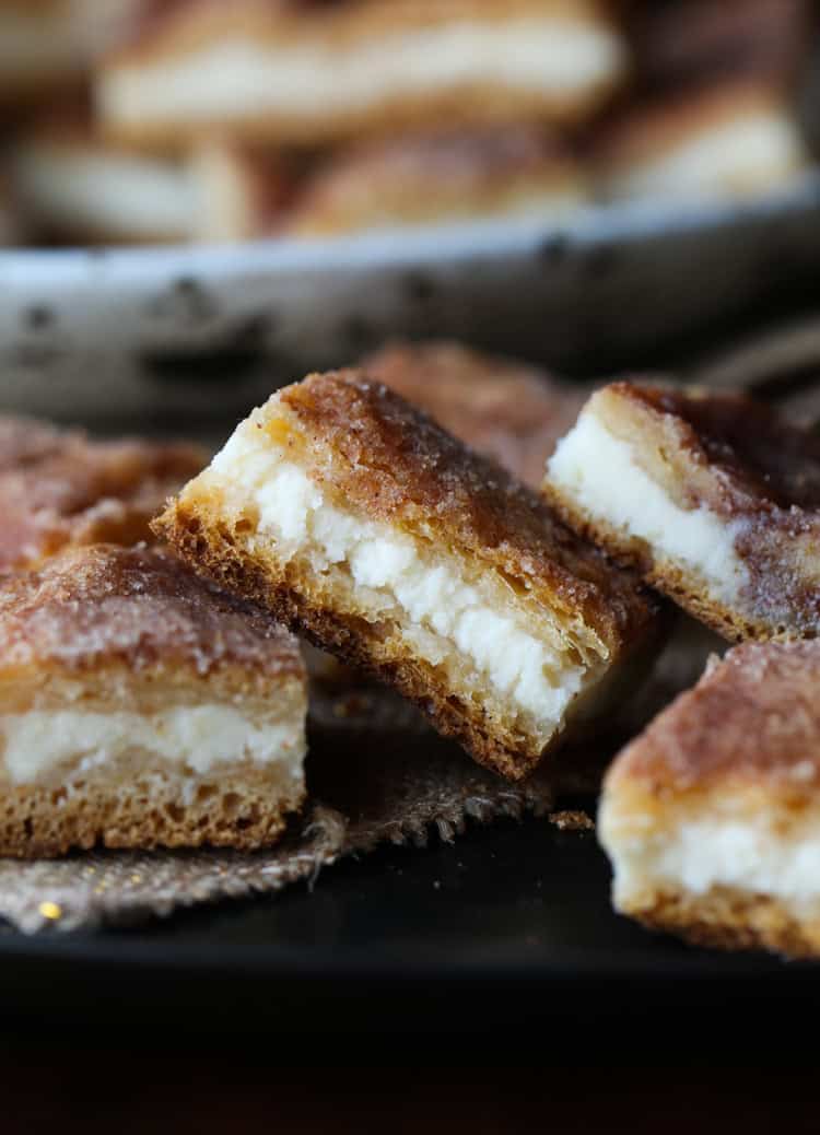 Sopapilla Cheesecake bars on a plate