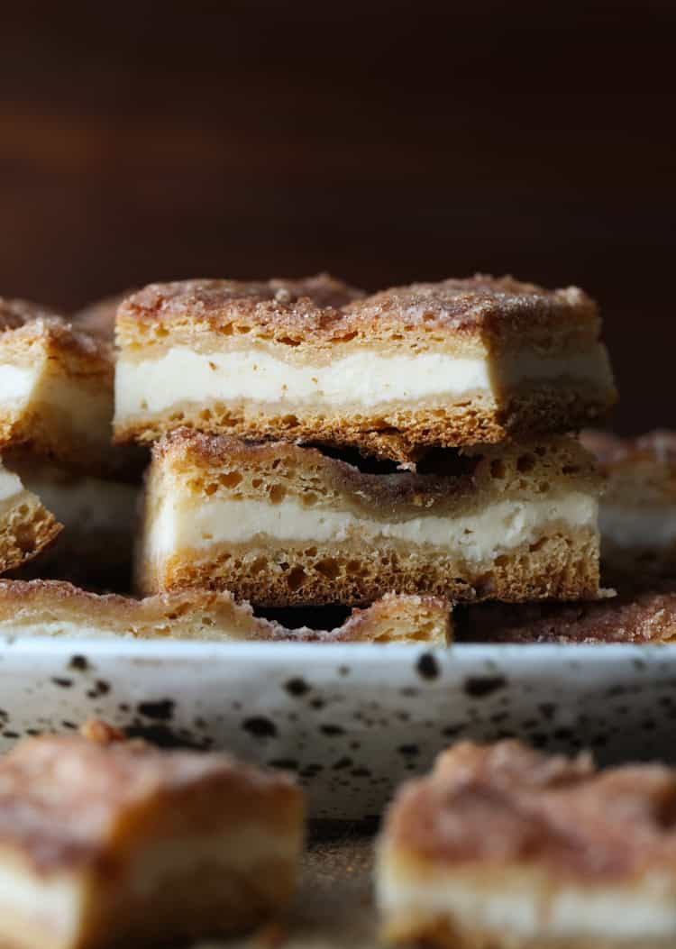 Two sopapilla cheesecake bars stacked on top of each other.