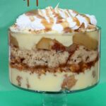 Side view of caramel apple trifle in a clear trifle bowl