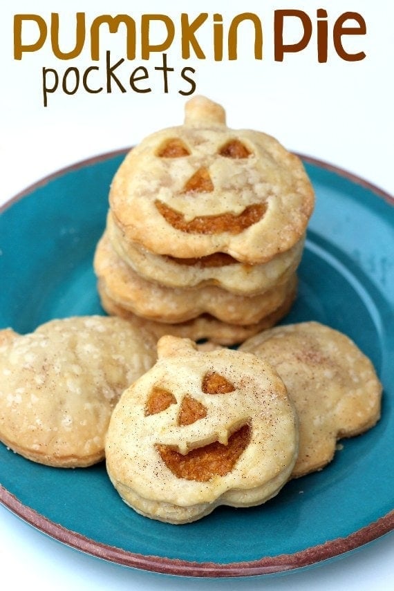 Overhead view of Pumpkin Pie Pockets with jack-o-lantern faces on a plate