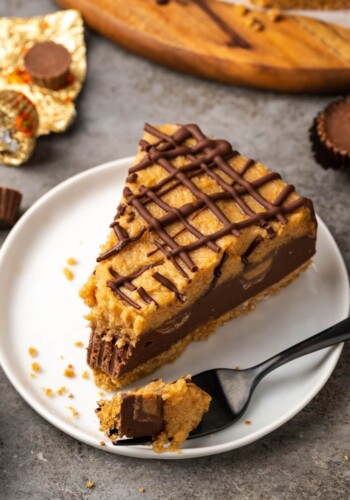 A slice of Reese's pie on a plate, next to a fork.
