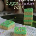 Lofthouse Sugar Cookie Bars with green frosting on a napkin