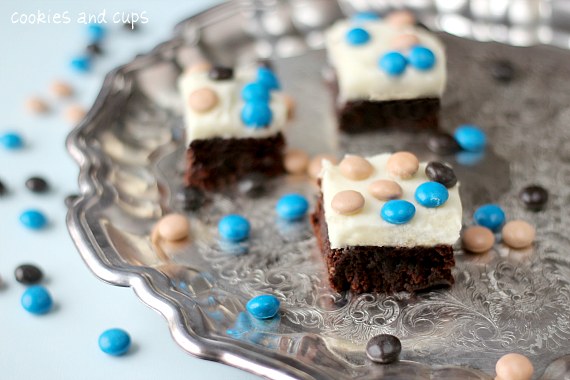 Coconut Cream Cheese frosted brownies on a tray