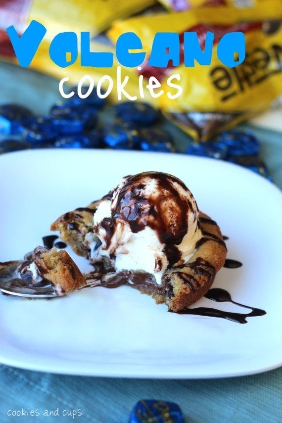 A volcano cookie on a plate with a bite on a spoon