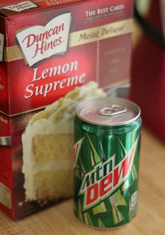 A can of Mountain Dew next to a box of cake mix.