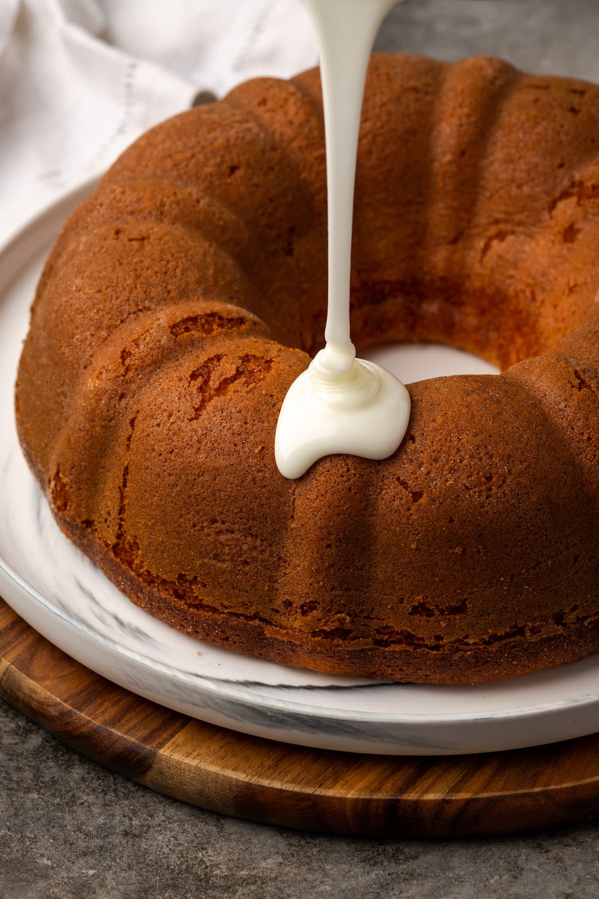 Glaze drizzled onto a baked Mountain Dew bundt cake.