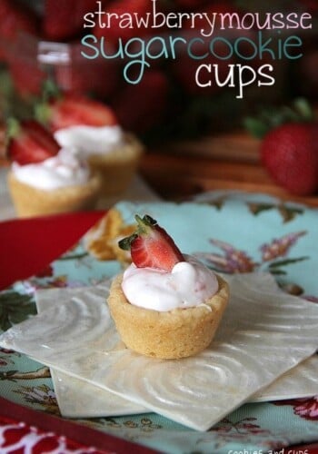 A strawberry mouse sugar cookie cup on a napkin