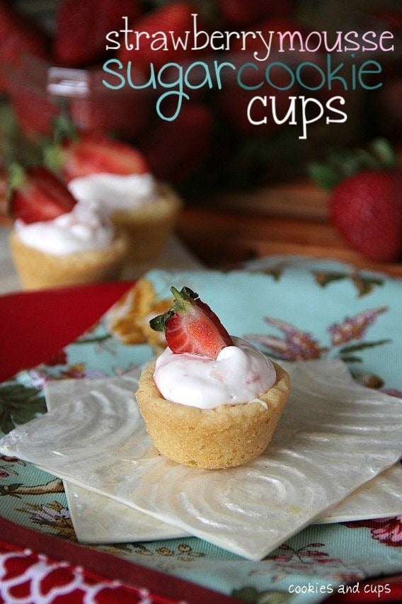 A strawberry mouse sugar cookie cup on a napkin