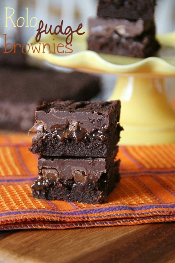 Rolo Fudge Brownies stacked on a napkin