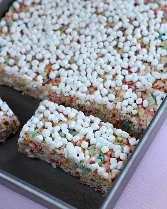 Fruity Pebbles Rice Krispie Treats on a baking tray.