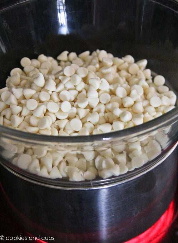 White chocolate chips in a glass bowl.