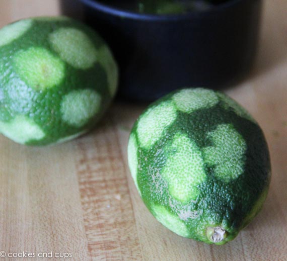 Two limes that have had their zest removed.