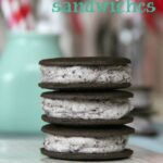 Three Oreo Cheesecake Frosting filled sandwich cookies, stacked