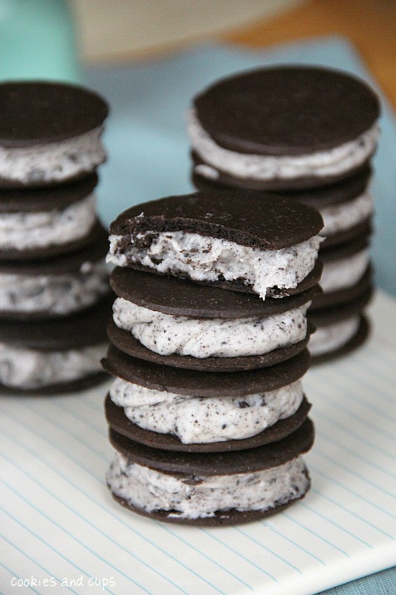 Three stacks of Oreo cheesecake frosting sandwich cookies.