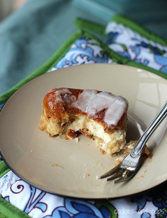 A piece of pull-apart monkey bread is served on a plate with a fork