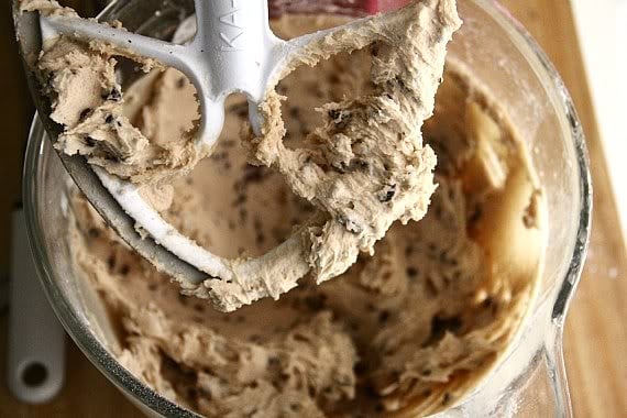 Chocolate chip cookie dough batter in a stand mixer bowl