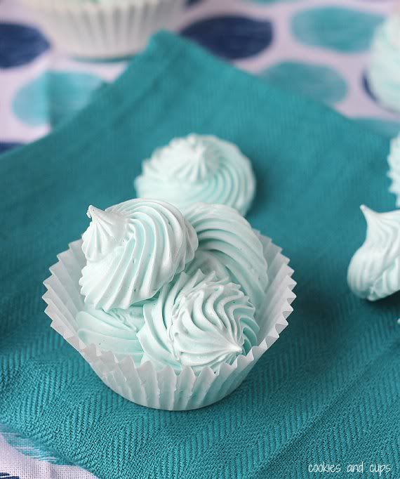 A few blue cotton candy meringues in a paper muffin cup