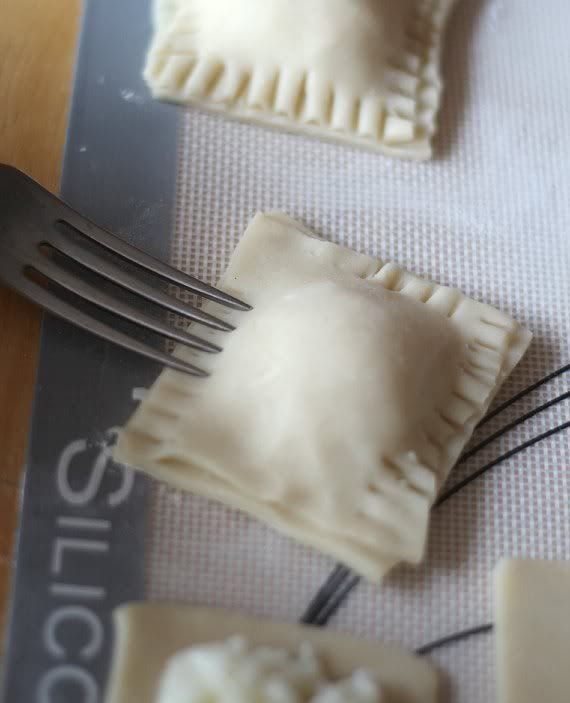 Squares of filled dough crimped with a fork