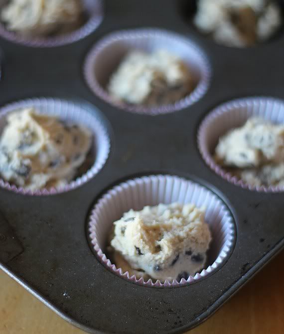 Chocolate chip cookie dough in paper-lined muffin tins