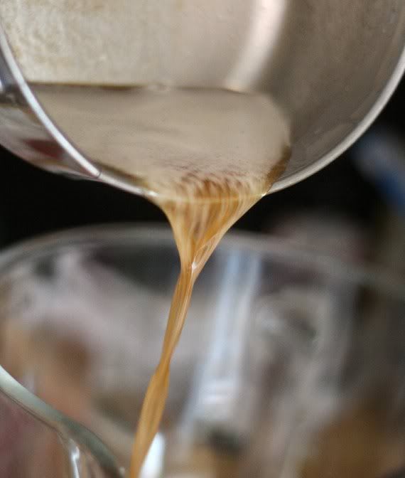 Melted butter being poured from a saucepan