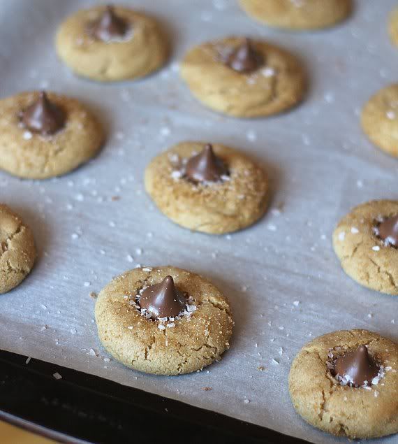 Salted caramel kiss cookies on a baking sheet