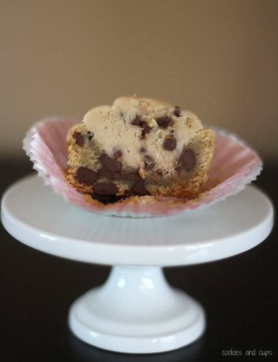 Close-up of a halved cookie dough cookie cup on a pedastal