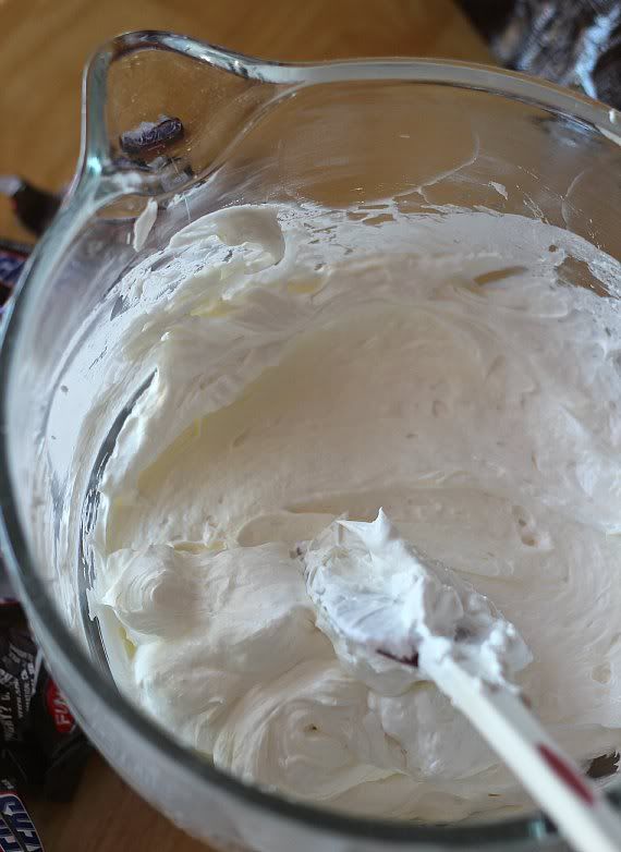 Cream cheese and whipped topping blended together in a mixing bowl