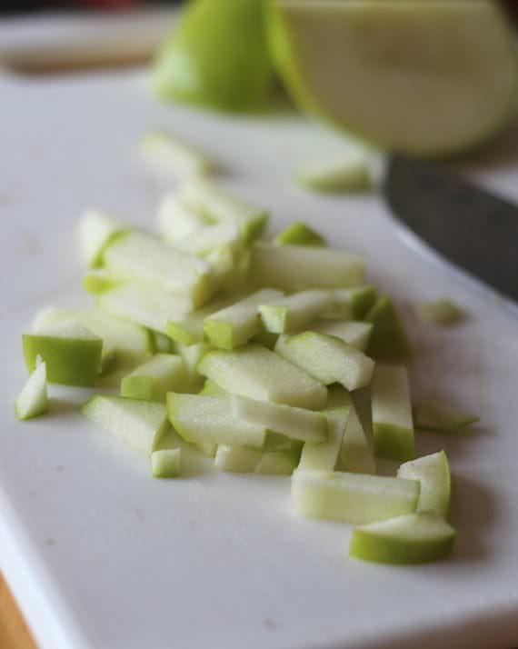 Chopped green apple on a cutting board