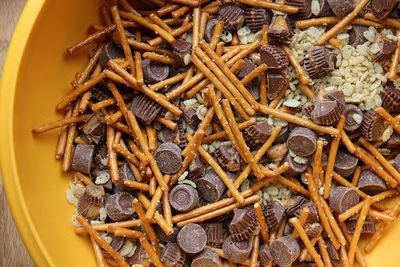 Pretzel sticks, Rolos, Mini Peanut Butter Cups, and Crispy Rice cereal in a bowl