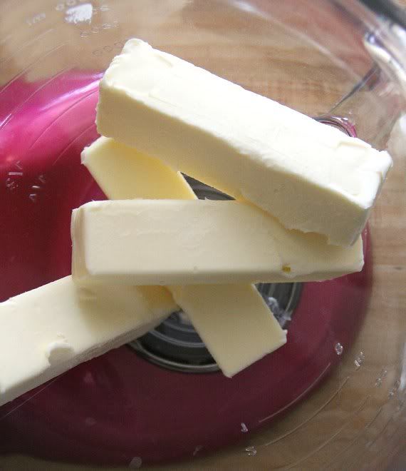 Four sticks of butter in a mixing bowl