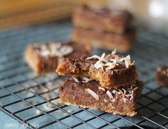 Coconut caramel bars on a cooling rack