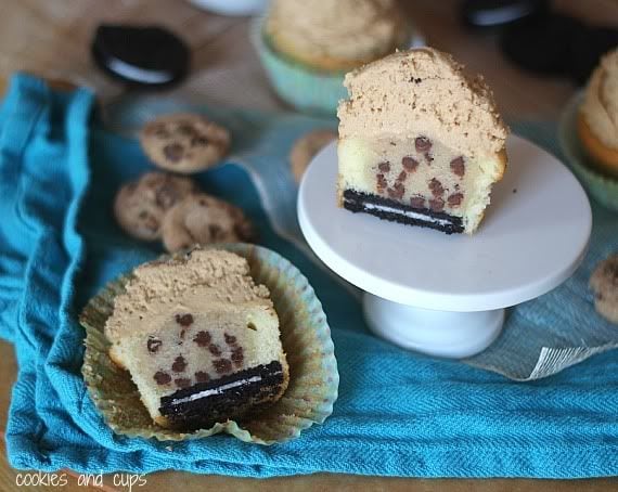 Halved cupcake with an Oreo cookie, cookie dough, and peanut butter frosting