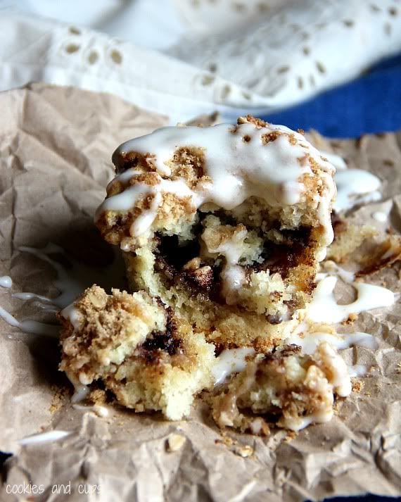 Gooey cinnamon muffin with icing broken in half