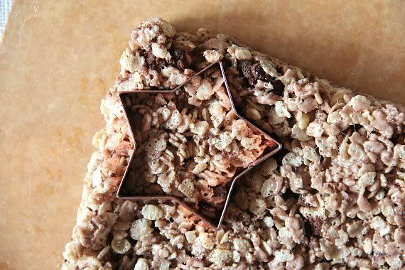 A star cookie cutter on a batch of rice krispie treats