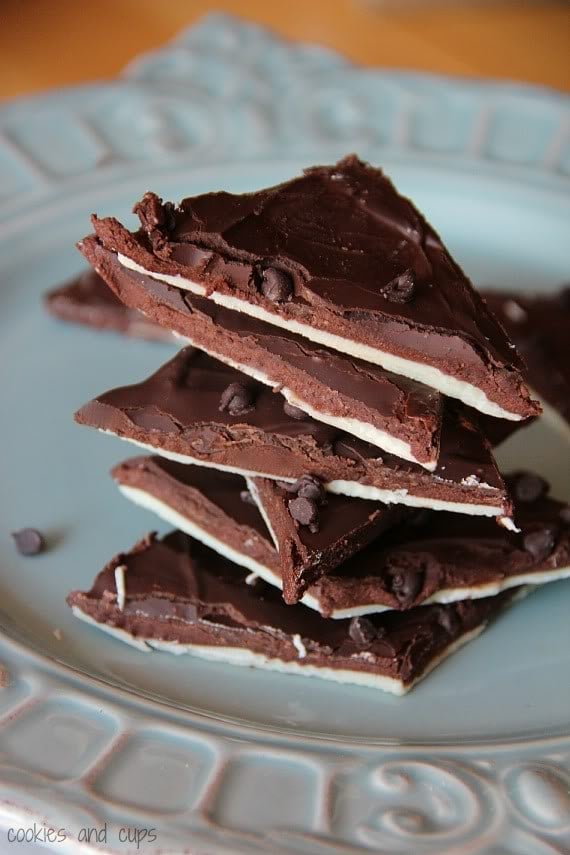 A stack of triangular pieces of brownie batter bark on a plate