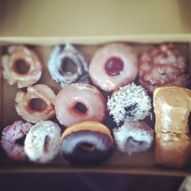 Top view of a box of gourmet doughnuts