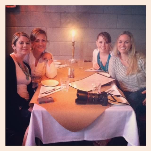 Four women seated at a restaurant table