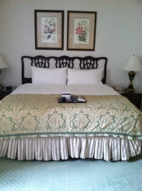 Photo of a bed at a hotel with country decor