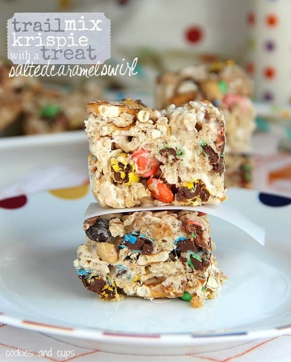 Two trail mix krispie treats stacked on a plate