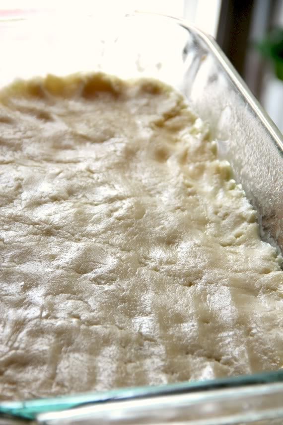 Buttery crust pressed into a rectangular baking pan