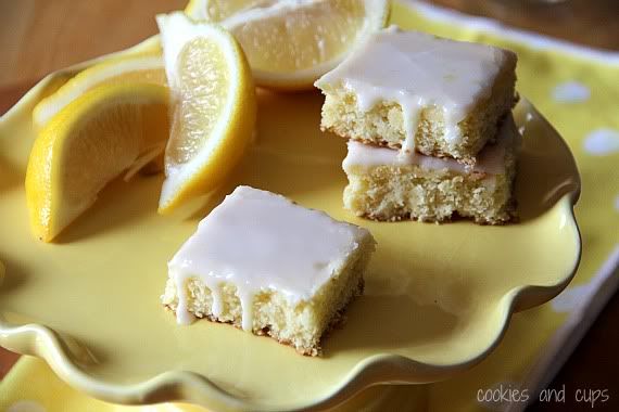 Glazed lemonade brownie bars on a yellow plate