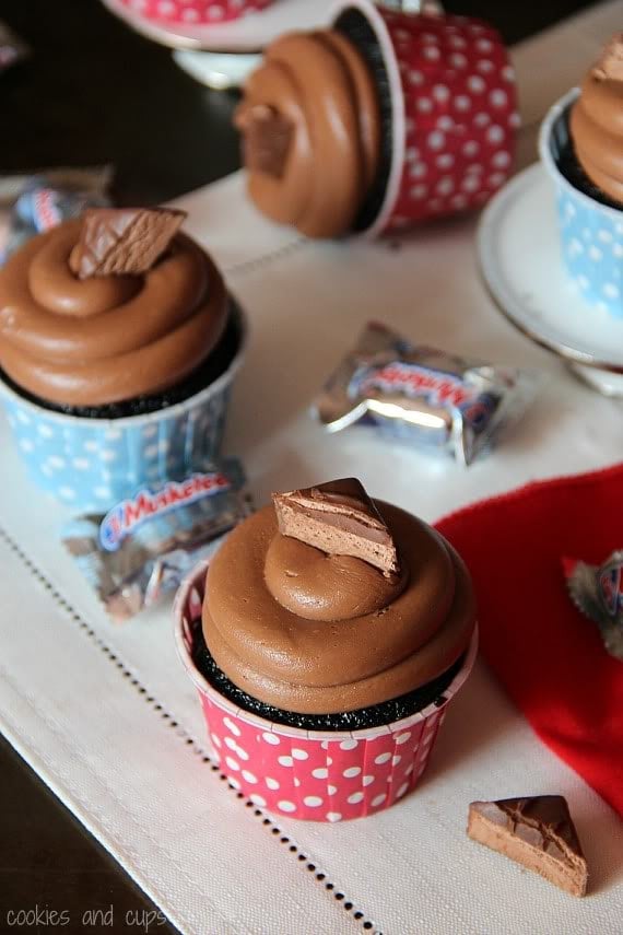 Close-up of chocolate-frosted cupcake with 3 Musketeers candy